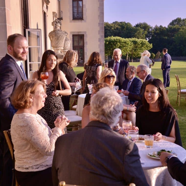 People enjoying the Rose Ball at Oheka Castle in 2024